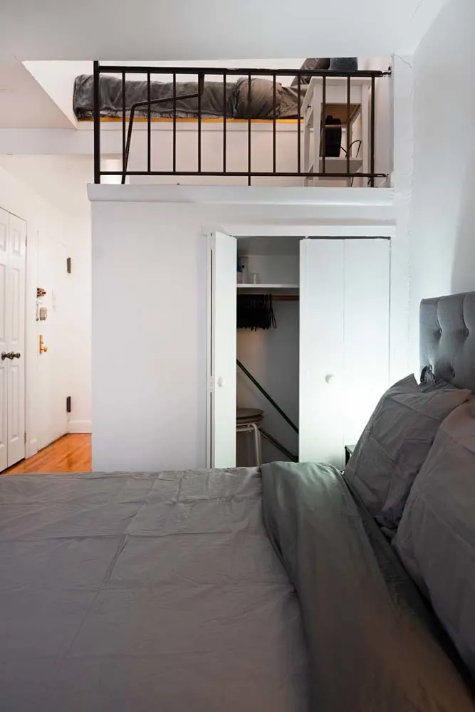 Compact bedroom with loft space.