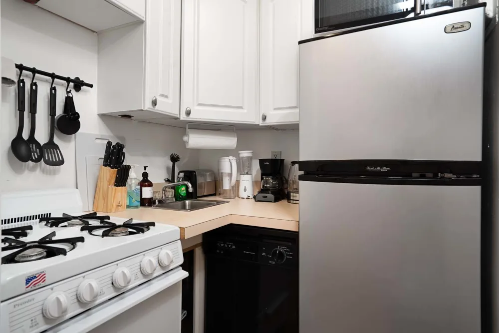 Compact modern kitchen with appliances.