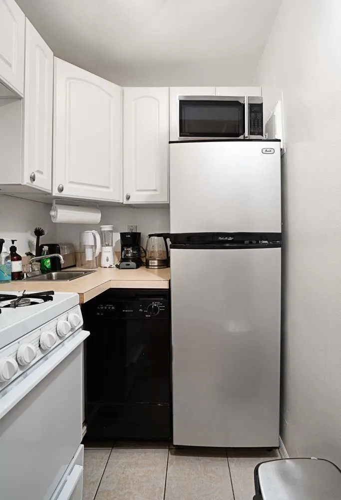 Compact kitchen with modern appliances.