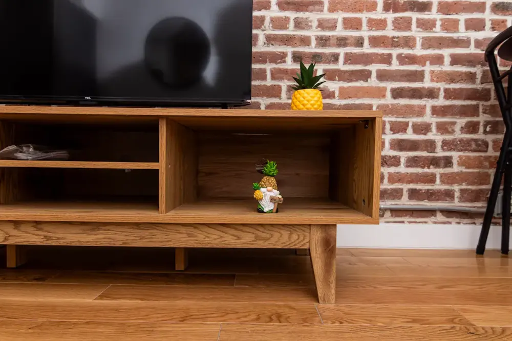 TV stand with brick backdrop