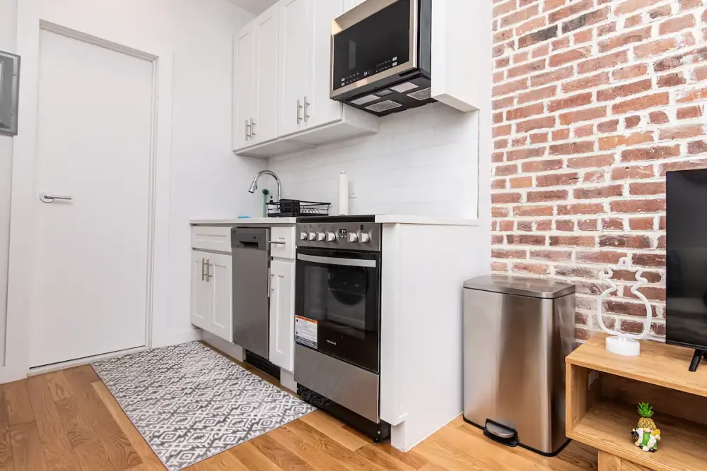 Modern kitchen with brick accent wall