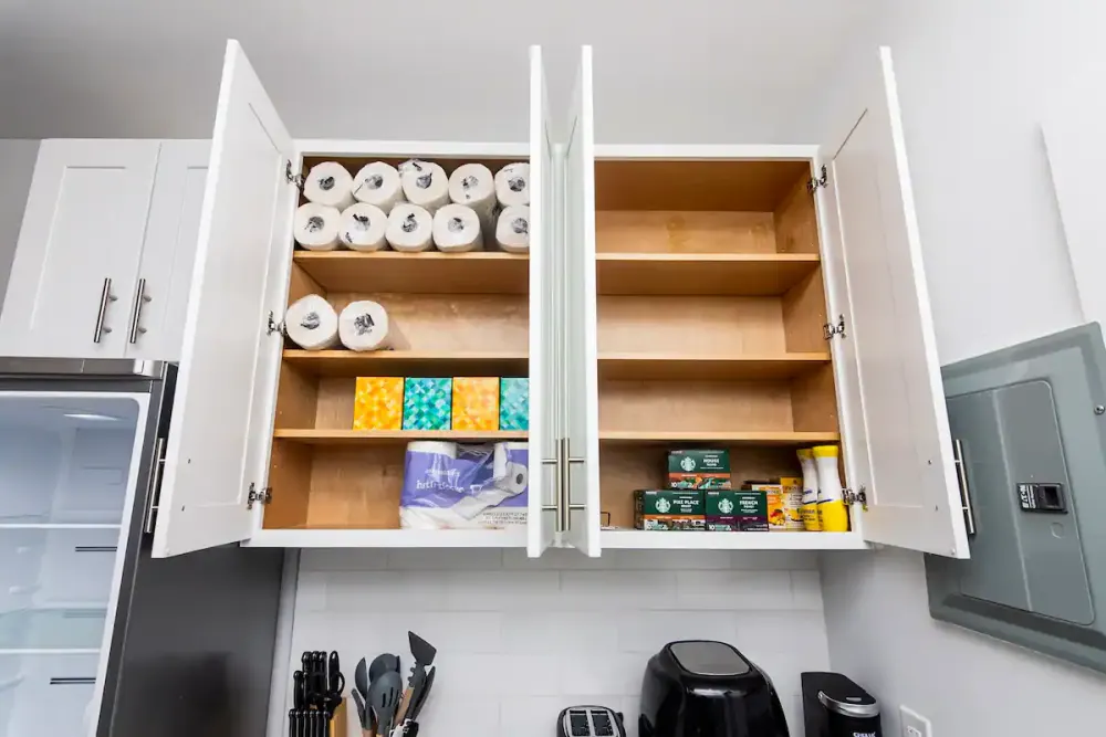 Fully stocked kitchen storage cabinet.