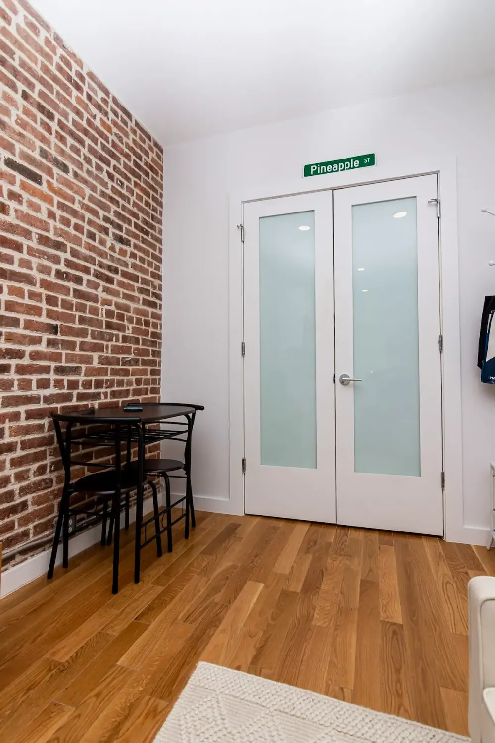 Cozy room with brick wall.