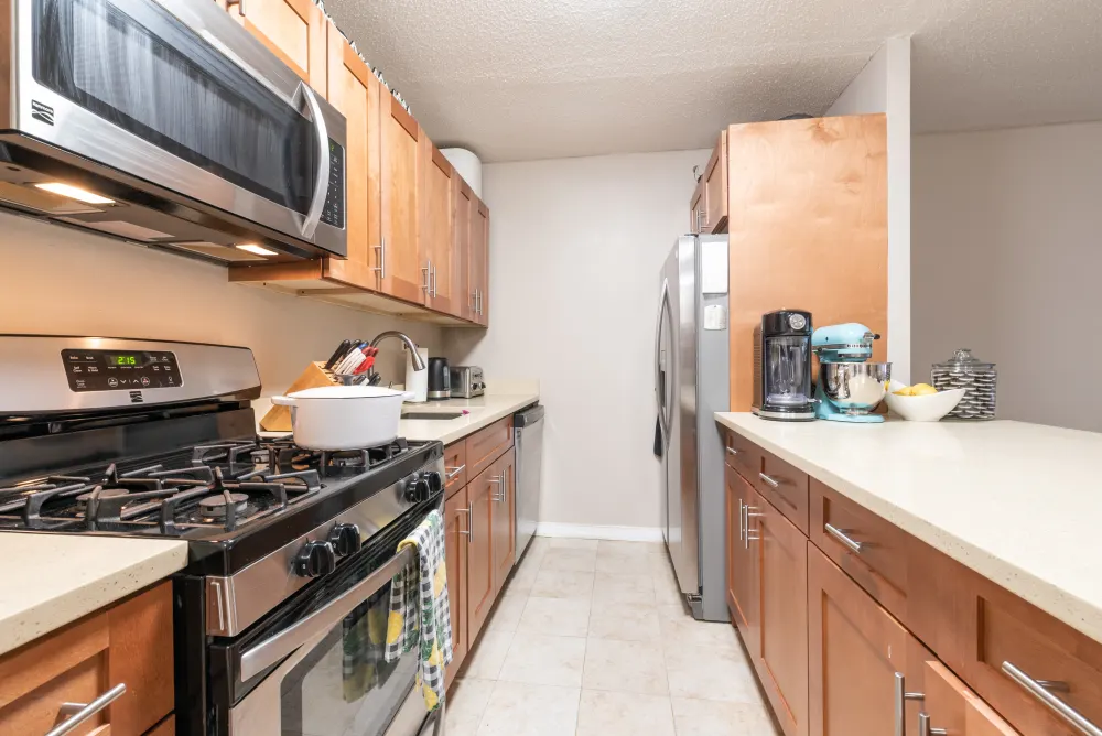 Modern kitchen with stainless steel appliances.