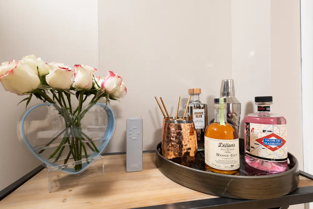 Elegant minibar with white roses.