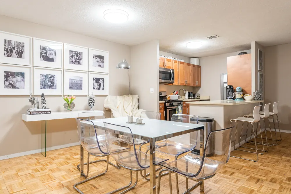 Modern dining area with kitchen.