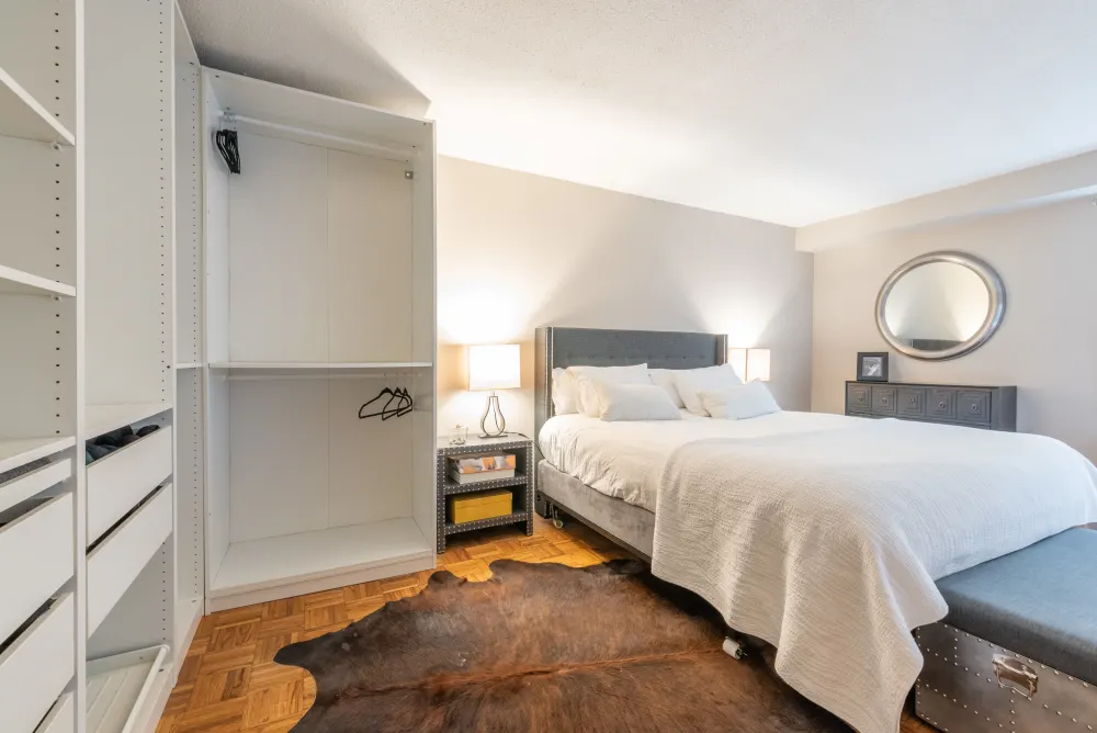 Elegant bedroom with open closet.