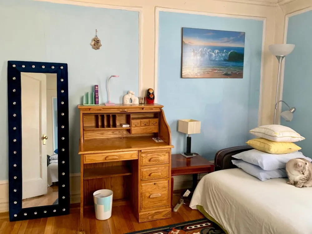 Cozy room with wooden desk.