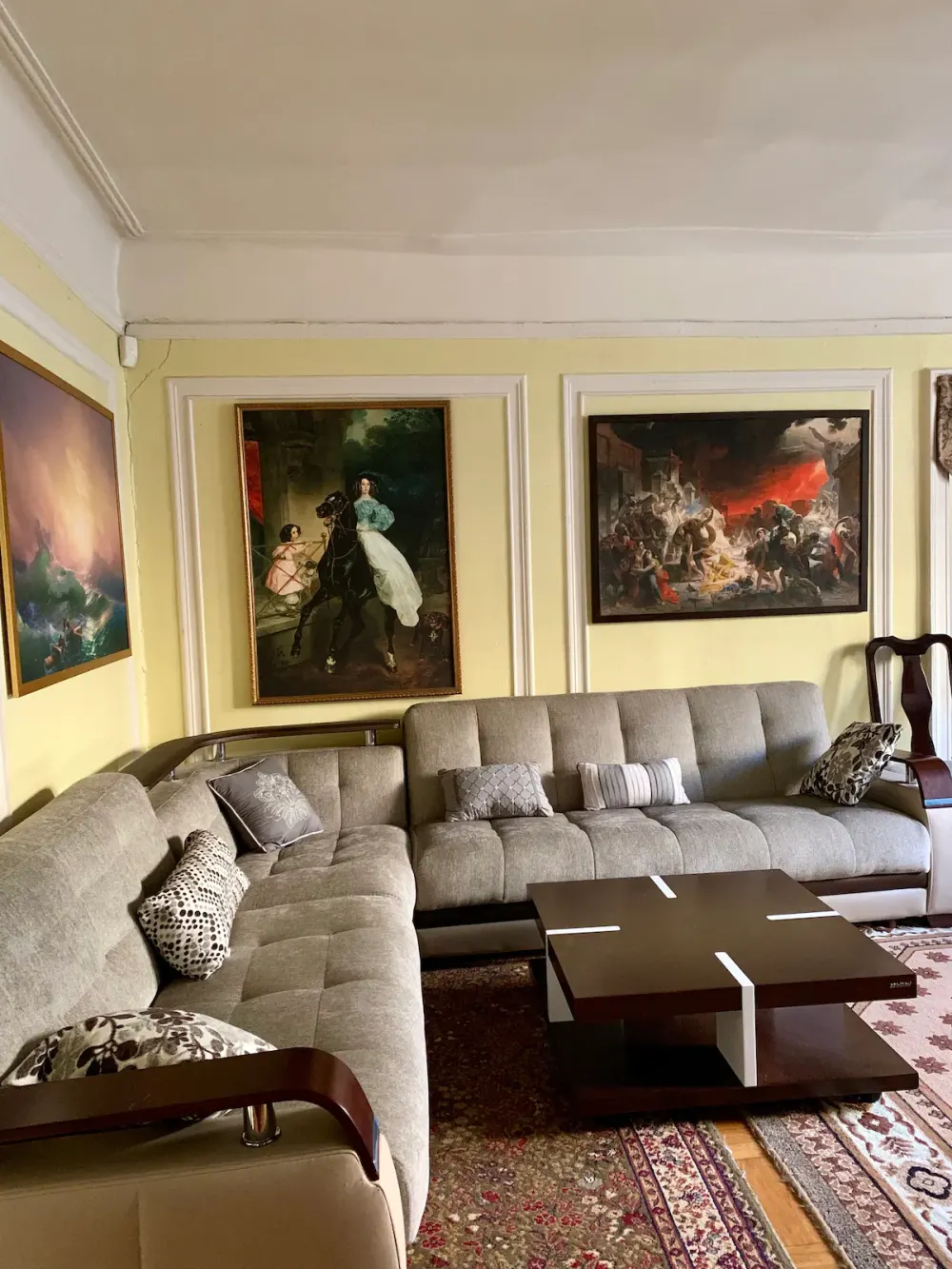 Elegant living room with classic paintings.