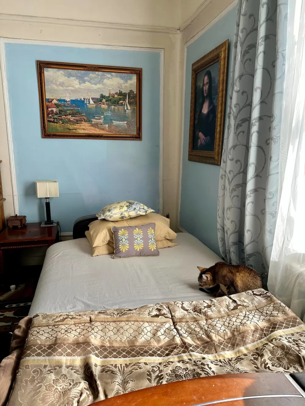 Cozy bedroom with captivating art.