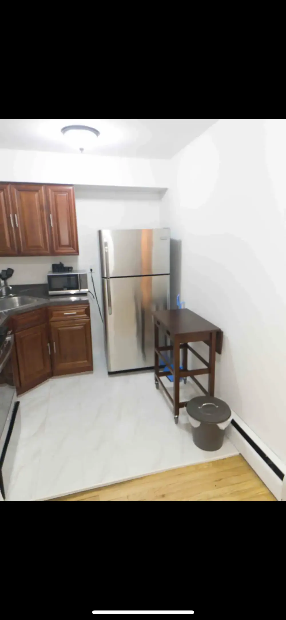 Compact kitchen with modern appliances.