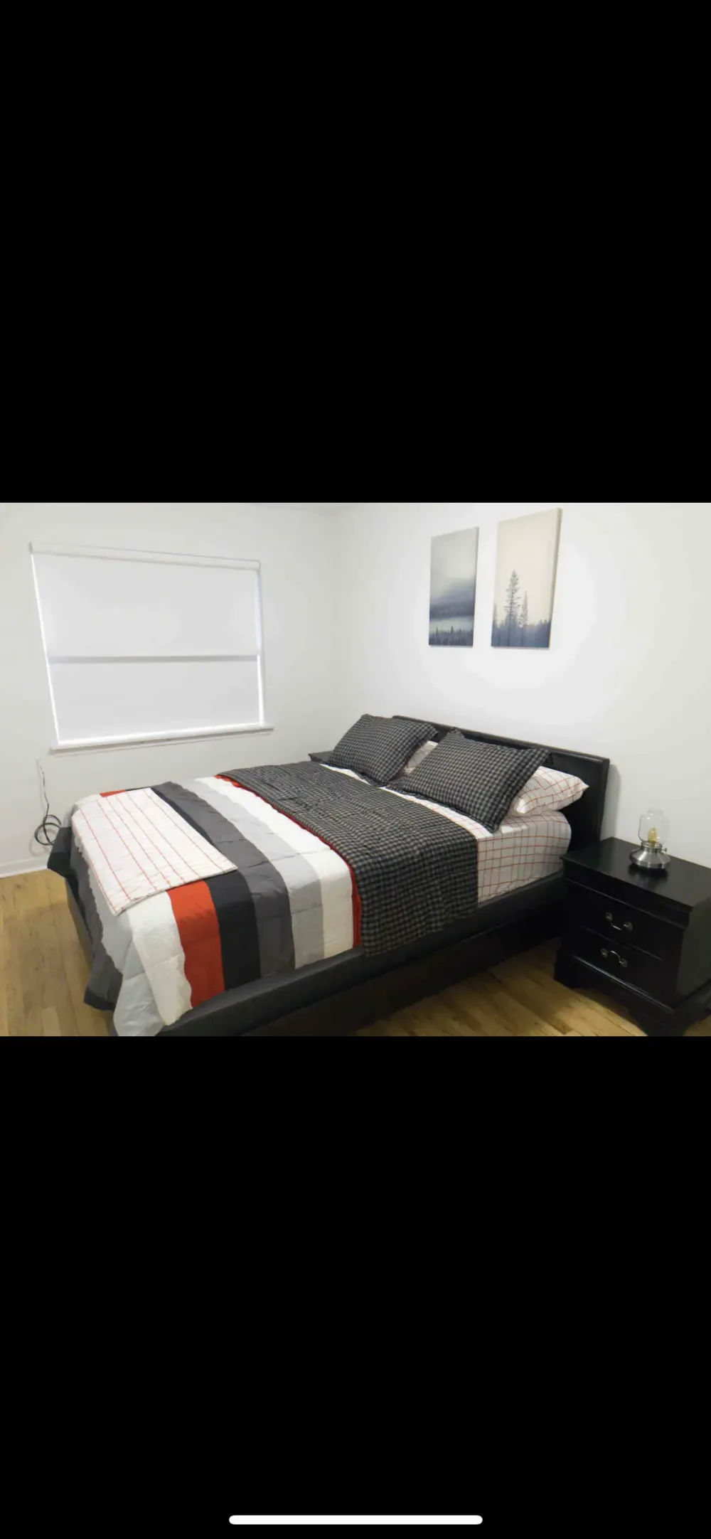 Modern bedroom with cozy decor.