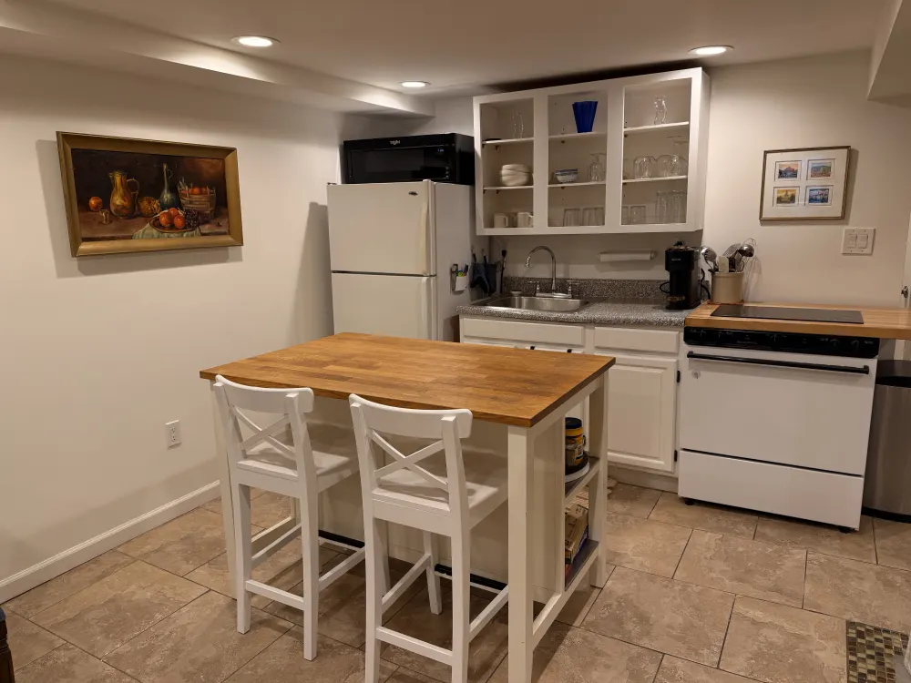 Cozy kitchen with wooden island.