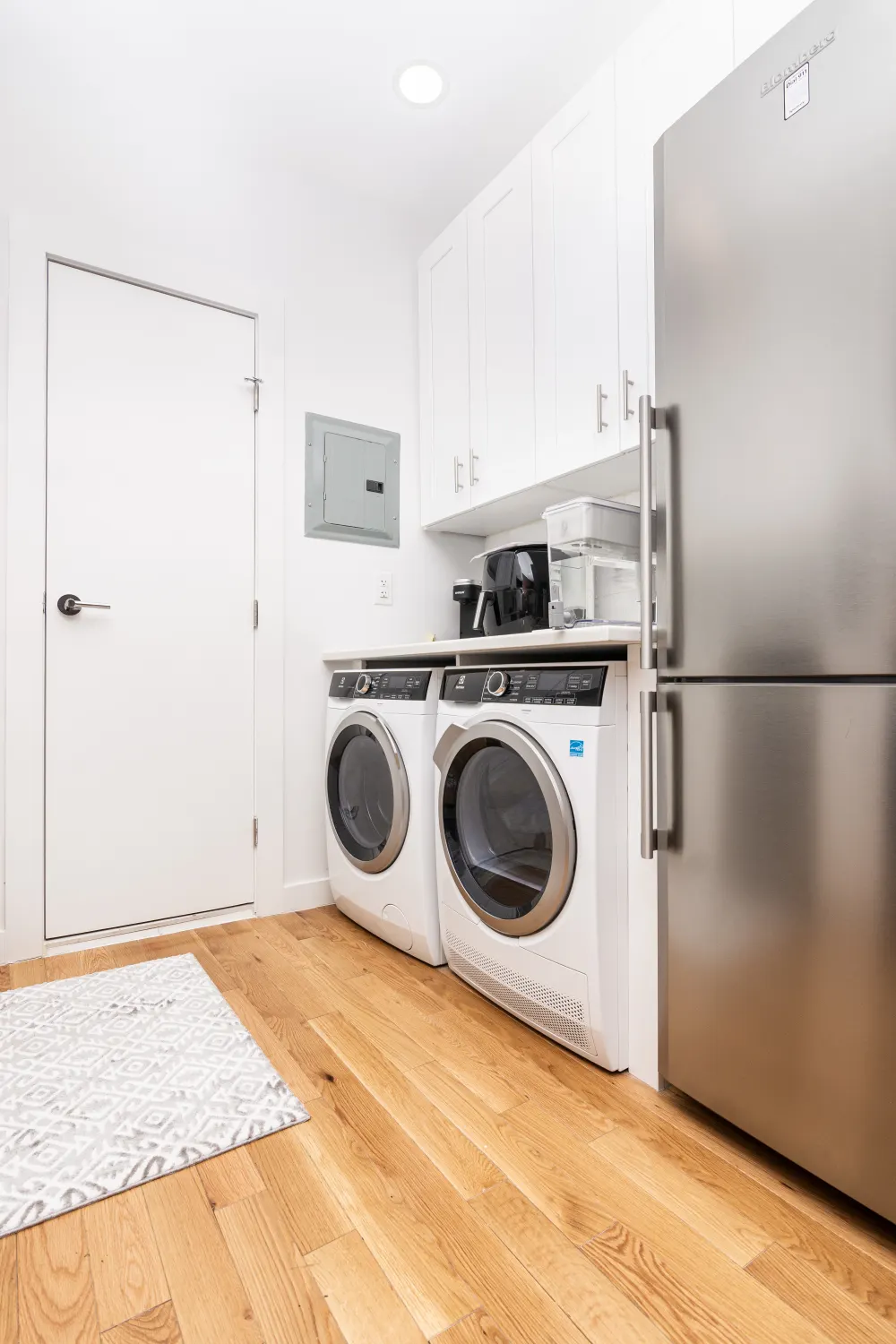 Modern laundry room with appliances.