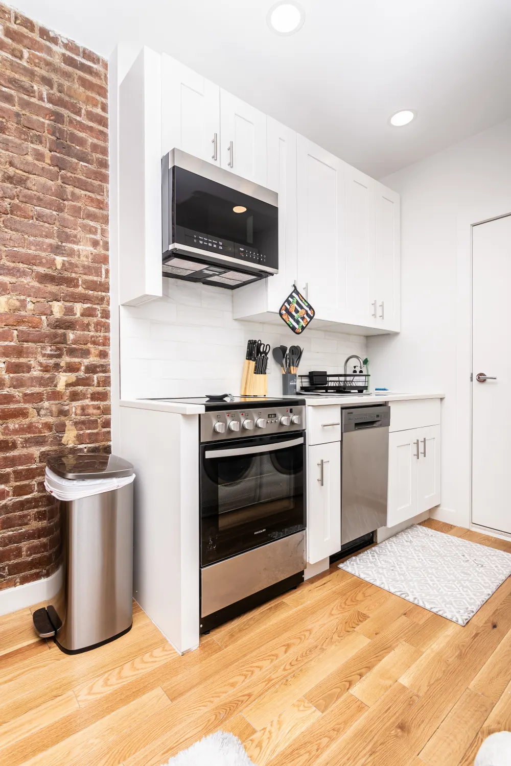 Cozy modern kitchen with bricks.