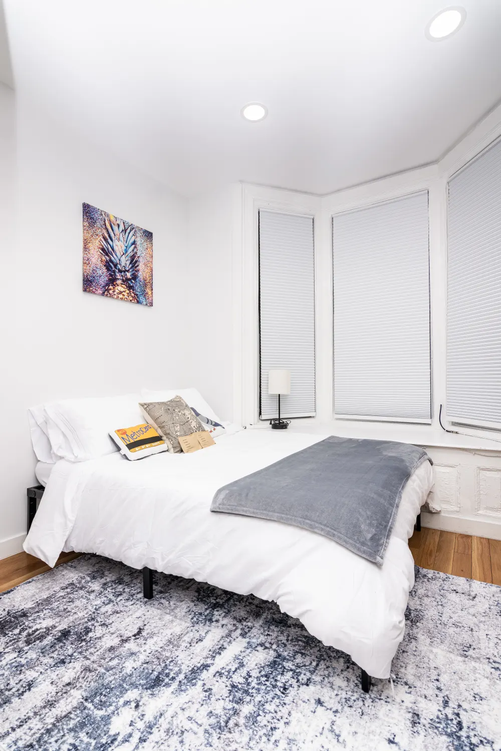 Modern bedroom with white decor.