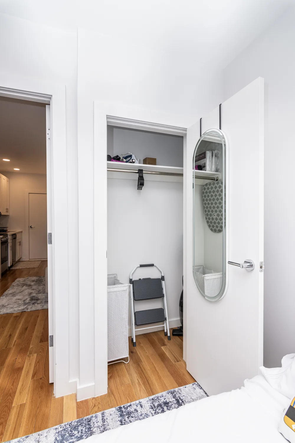 Modern bedroom with open closet.