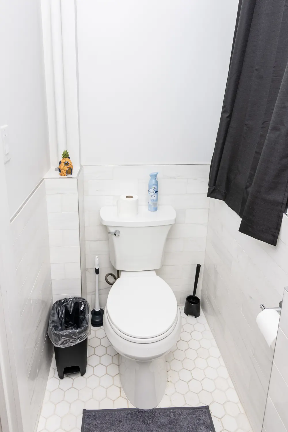 Clean, modern bathroom with toilet.