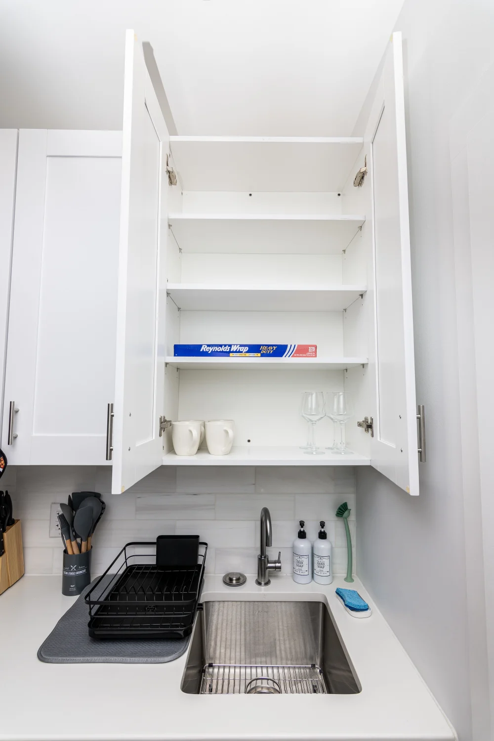 Modern kitchen cabinet above sink.