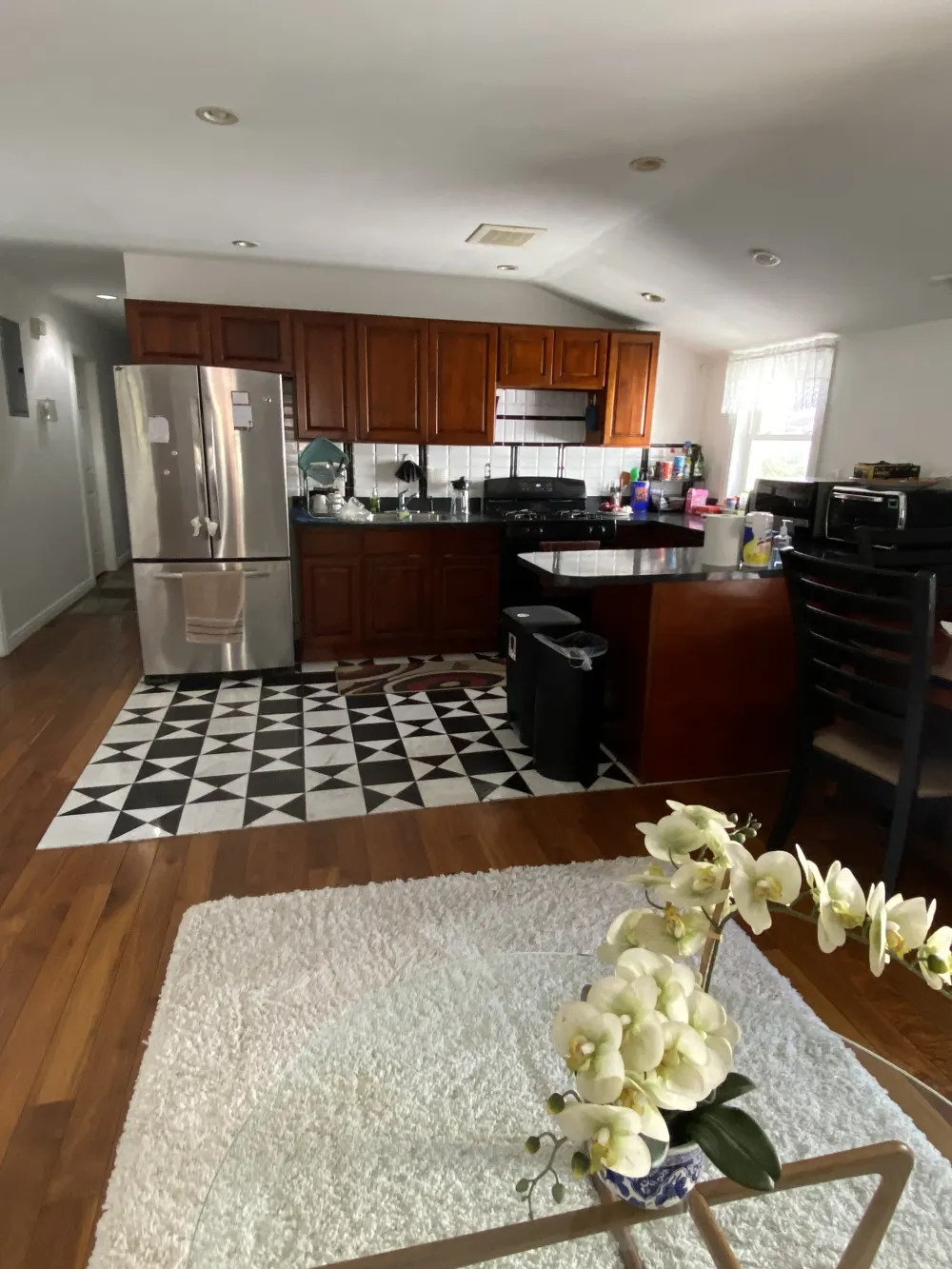 White flowers on textured rug.