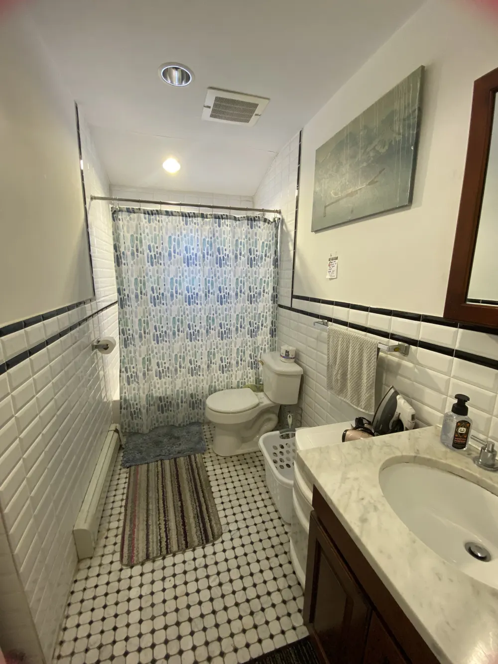 Small bathroom with tiled floor.