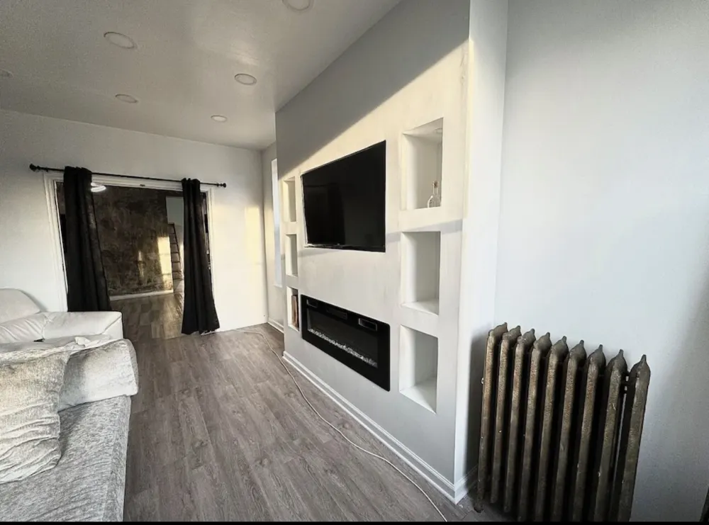 Modern living room with built-in fireplace.