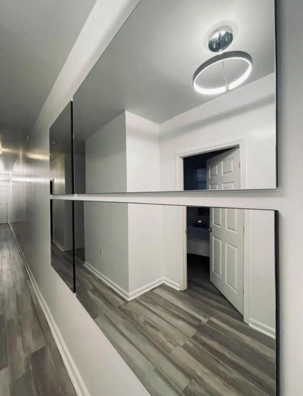Modern hallway with large mirrors.