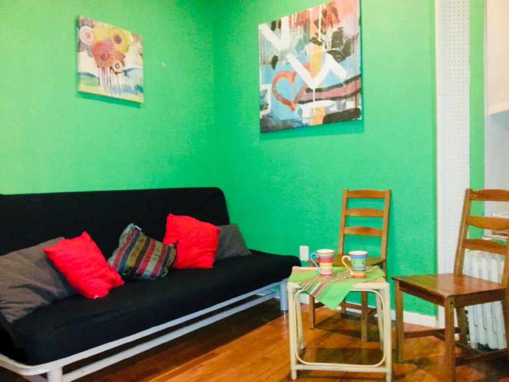 Bright cozy room with paintings.