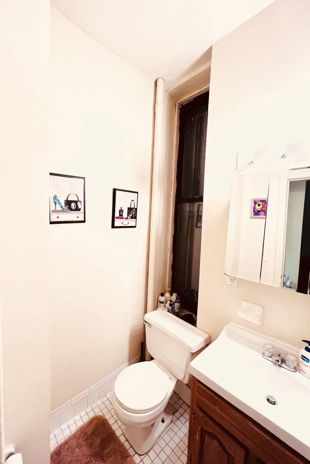 Cozy bathroom with wall decor.