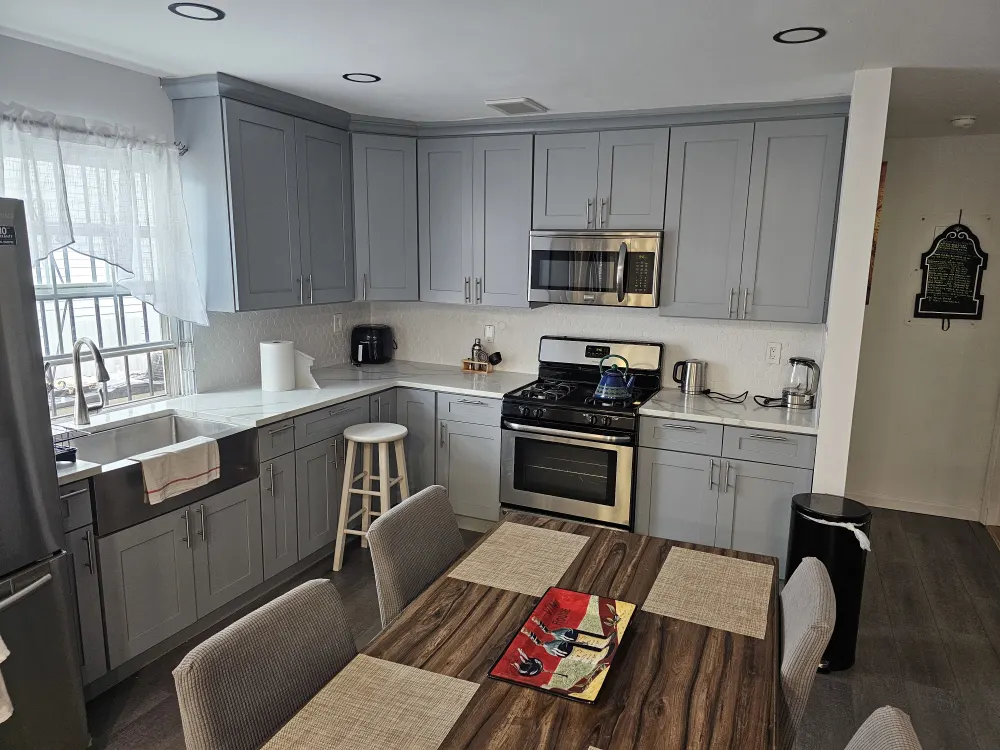 Modern kitchen with gray cabinets.
