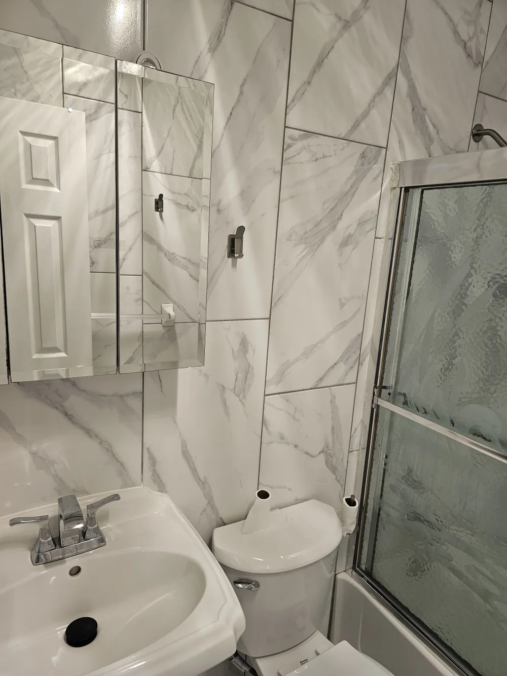 Modern bathroom with marble tiles.