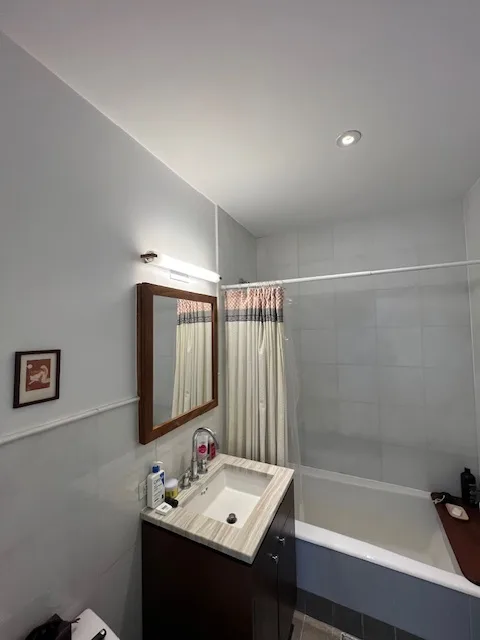Modern bathroom with shower curtain.