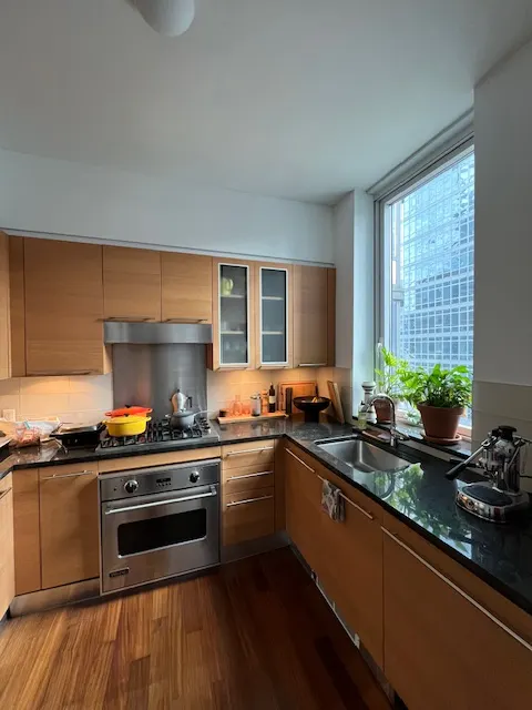 Modern kitchen with large window.