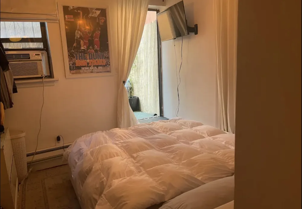 Cozy bedroom with white bedding.