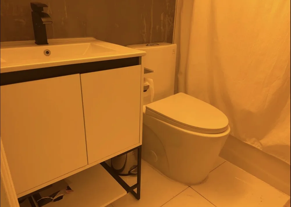 Compact bathroom with modern fixtures.