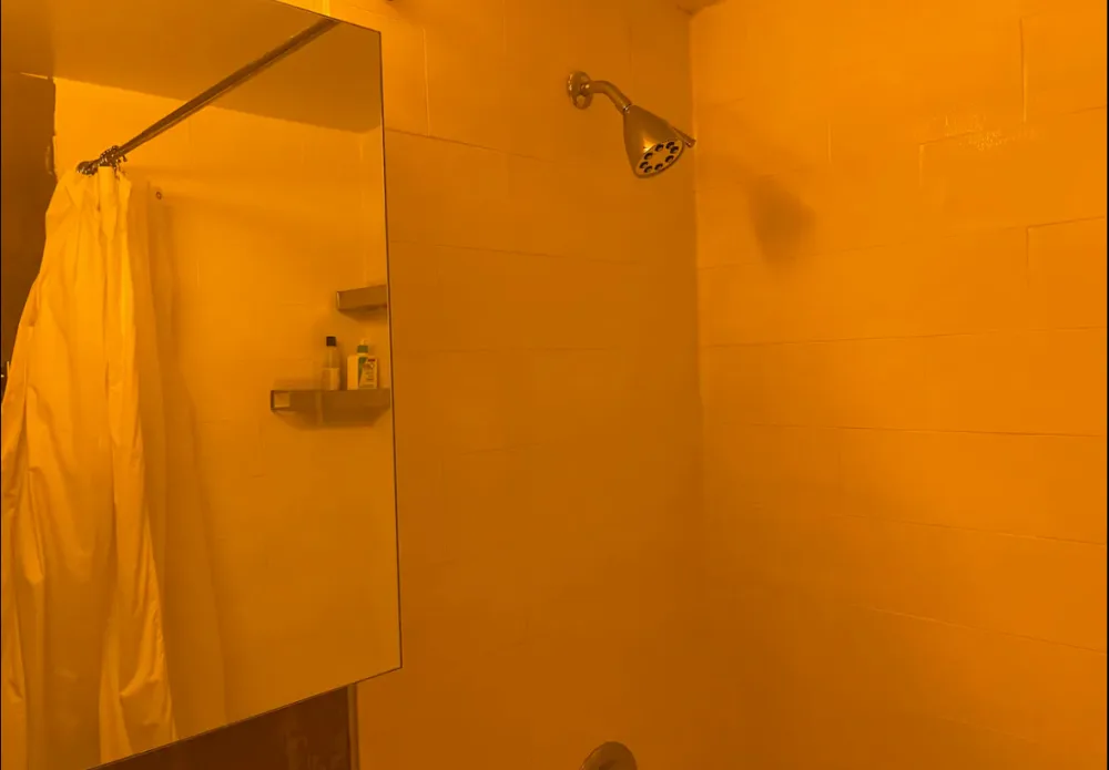 Modern bathroom with shower head.