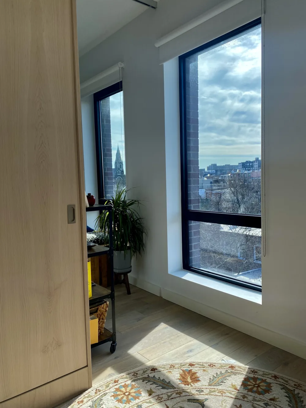 Room with large sunny window.