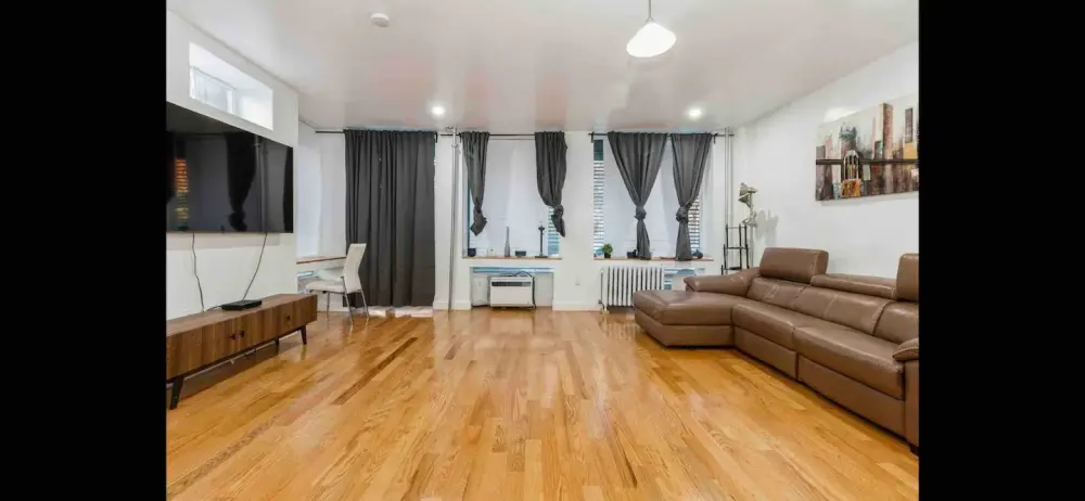 Spacious living room with couch.