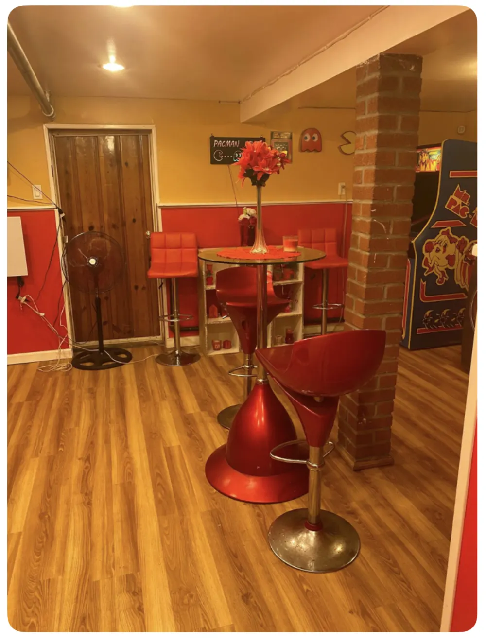 Retro-themed room with arcade machine.