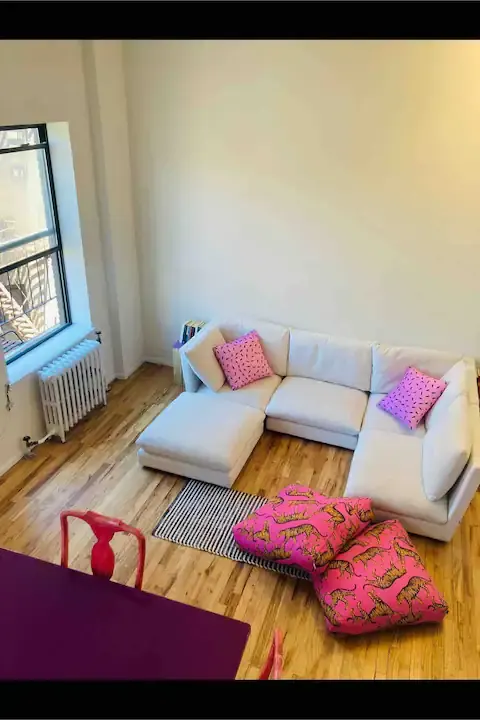 Bright living room with sectional sofa.