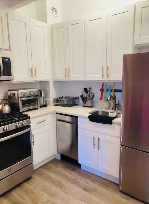 Modern kitchen with stainless appliances.