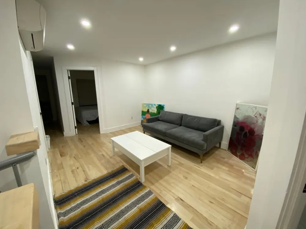 Minimalist room with a sofa.