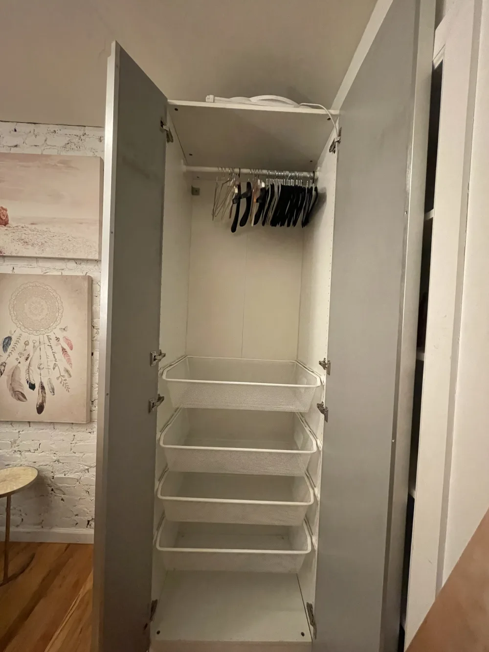 Empty wardrobe with several hangers.