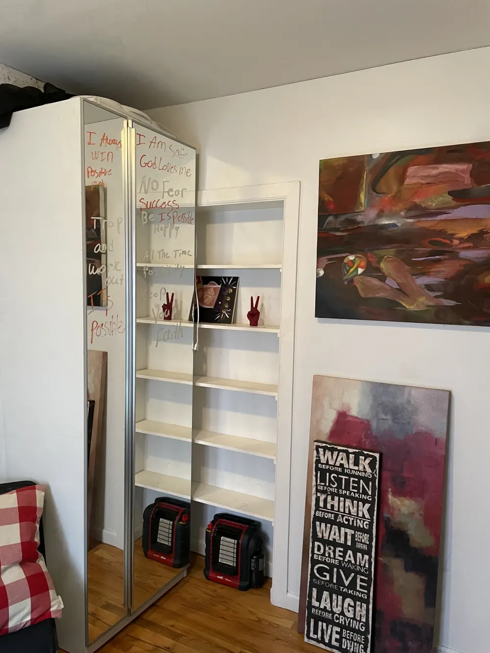 Bedroom corner with motivational decor.