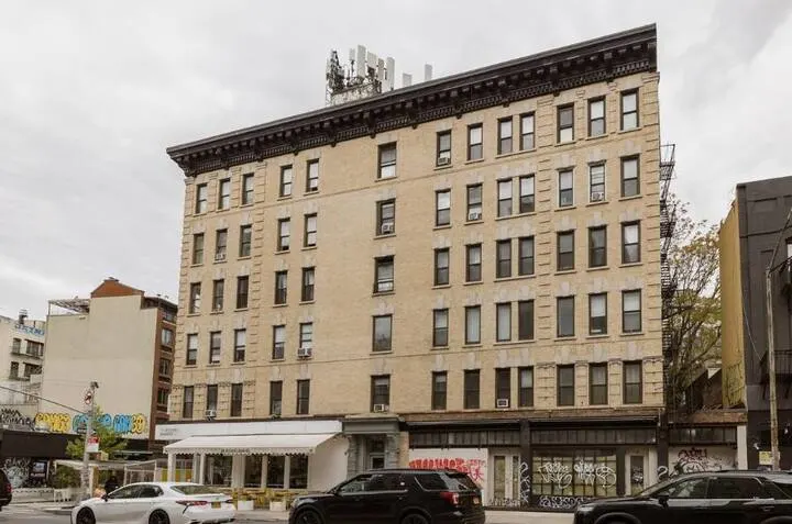 Urban five-story brick building.