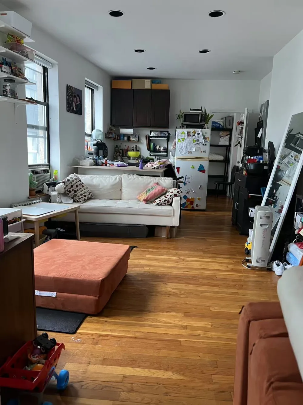 Open-plan apartment with wooden flooring.
