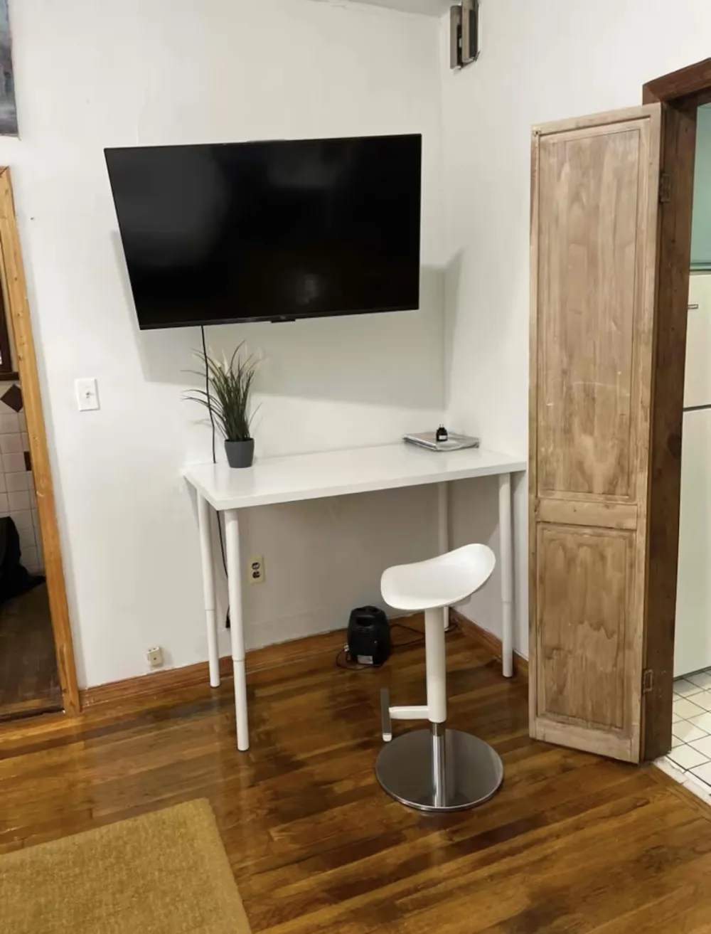 Minimalist workspace with television setup.