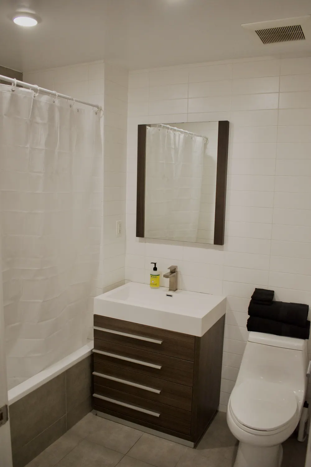Modern bathroom with white tiles.