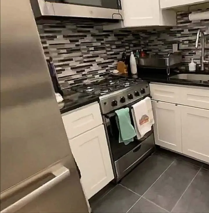 Modern kitchen with mosaic backsplash.