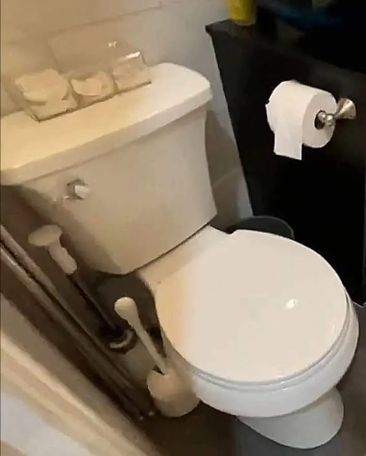 Small bathroom with toilet essentials.